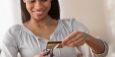 NFP-creditcardpay0220young-woman-cutting-up-credit-card-id155012127