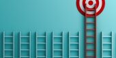 NRT-RetGoallong-red-ladder-to-goal-target-the-business-concept-on-blue-pastel-picture-id1055547196